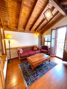 a living room with a couch and a coffee table at Authentic Turkish Home Suite in Istanbul