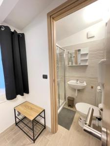 a bathroom with a toilet and a sink at Hotel Serena in Arenzano +102 photos