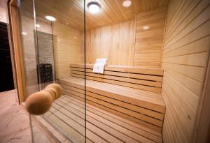 a bathroom with a sauna with a shower at Hotel Residence Plaza in Tbilisi City
