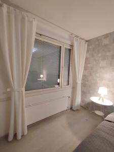 Postel nebo postele na pokoji v ubytování Nika Apartments