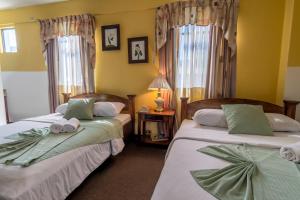 Postel nebo postele na pokoji v ubytování Hotel Amón Real Costa Rica
