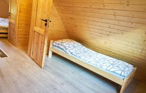 Posteľ alebo postele v izbe v ubytovaní Domek w Górach Sowich "Go Sowie" Jacuzzi Basen Sauna
