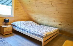 Posteľ alebo postele v izbe v ubytovaní Domek w Górach Sowich "Go Sowie" Jacuzzi Basen Sauna