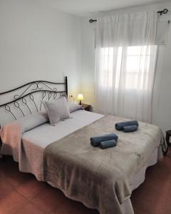 Postel nebo postele na pokoji v ubytování Apartamentos El Jablito