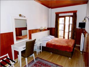 Postel nebo postele na pokoji v ubytování Hotel Olympic