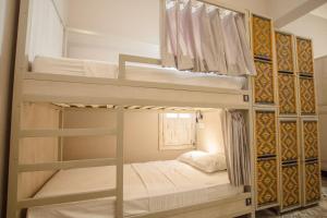 a couple of bunk beds in a room at Casa Avelina Boutique Hostel in Santa Marta