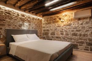 Postel nebo postele na pokoji v ubytování Villa Anaflo + 12 fotografií