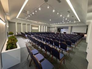 an empty room with rows of chairs in a lecture hall at Best Western Plus Paradise Hotel Dilijan in Dilijan +283 photos