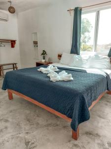 מיטה או מיטות בחדר ב-Hotel Xa´an Bacalar