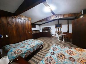 En eller flere senge i et værelse på Arenal Xilopalo