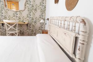 Postel nebo postele na pokoji v ubytování Hostal El Pozo