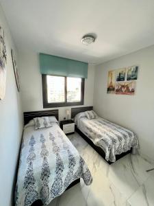 Łóżko lub łóżka w pokoju w obiekcie Sunset Drive Resort & Spa