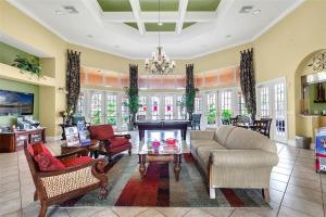 a living room filled with furniture and a chandelier at SOLANA 7 Bed Rooms FAMILY VACATION VILLA-Private Pool and SPA in Davenport
