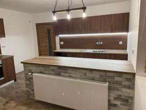 a kitchen with a stone counter in a room at Villa Euphoria in Bersin