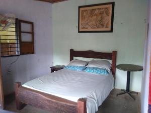 Postel nebo postele na pokoji v ubytování El Garaje Hostal