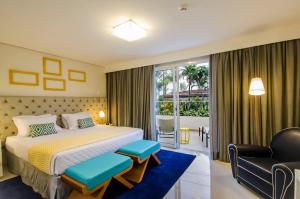 Cama ou camas em um quarto em Doral Guarujá