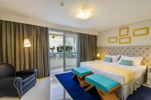 Cama ou camas em um quarto em Doral Guarujá