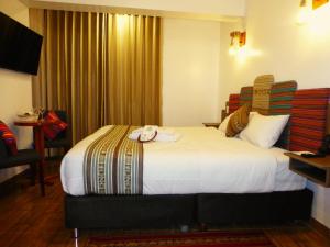 Posteľ alebo postele v izbe v ubytovaní Yanay Collection