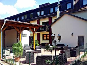 a patio in front of a building at Hotel an der Uffe in Bad Sachsa