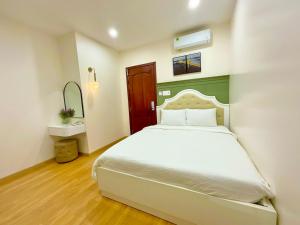Khải Hoàn Hotel 2 tesisinde bir odada yatak veya yataklar