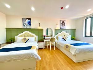 Katil atau katil-katil dalam bilik di Khải Hoàn Hotel 2