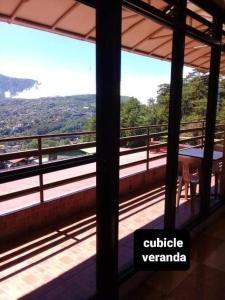 a view from a balcony with a view of a valley at ASHBURN'S TRANSIENT BAGUIO - BASIC and BUDGET SLEEP and GO Accommodation, SELF SERVICE in Baguio