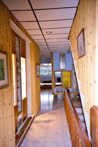 a hallway of a building with wooden walls and stairs at Art Taiwan Homestay in Shunan