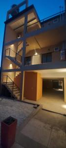 a large building with a staircase on the side of it at Alquiler cintia in Gualeguaychú