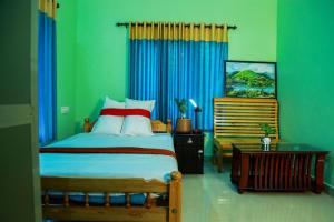 Postel nebo postele na pokoji v ubytování Puzhayoram home stay, Palakkuli, Mananthavadi wayanad kerala