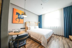 Fotografija v galeriji nastanitve 银座佳驿精致酒店济南英雄山立交桥鲁能领秀城店 v mestu Jinan