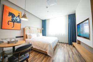 Fotografija v galeriji nastanitve 银座佳驿精致酒店济南英雄山立交桥鲁能领秀城店 v mestu Jinan