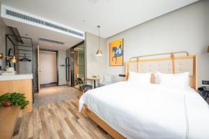 Fotografija v galeriji nastanitve 银座佳驿精致酒店济南英雄山立交桥鲁能领秀城店 v mestu Jinan