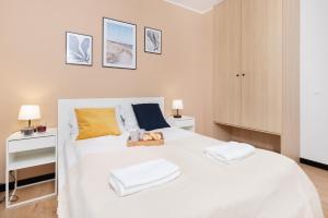 Cama o camas de una habitación en Seaview Apartment Nexo by Renters Prestige