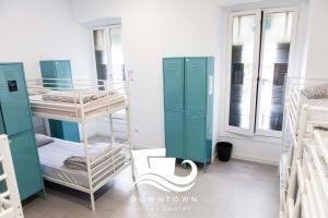 Postel nebo postele na pokoji v ubytování Downtown River Hostel