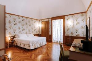 Postel nebo postele na pokoji v ubytování Santa Rosa Relais