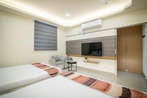 Postel nebo postele na pokoji v ubytování Jialai Homestay