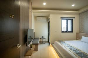 Postel nebo postele na pokoji v ubytování Jialai Homestay