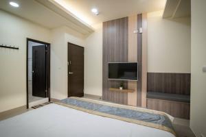 TV a/nebo společenská místnost v ubytování Jialai Homestay