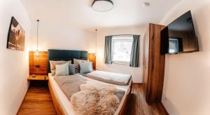 Postel nebo postele na pokoji v ubytování Bergmoment Apartments