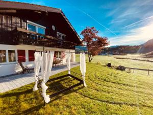 a house with a gazebo in front of it at Landhaus am Schneewittchenberg in Sonthofen