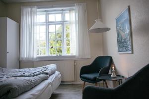 Postel nebo postele na pokoji v ubytování Langebjerg Pension & Spisested