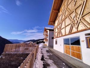 a view of a building with a wooden roof at Zimmererhof in Bressanone +17 photos