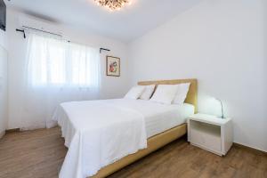 Postel nebo postele na pokoji v ubytování Villa Juhuhu