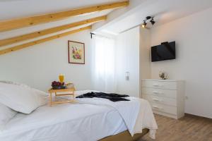 Postel nebo postele na pokoji v ubytování Villa Juhuhu