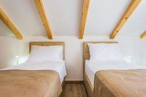 Postel nebo postele na pokoji v ubytování Villa Juhuhu