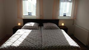 מיטה או מיטות בחדר ב-Ferienhaus Pauline