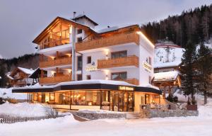 a large building in the snow in front at Residence Panorama Pfelders in Pfelders