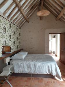 Postelja oz. postelje v sobi nastanitve Le Petit Pavillon
