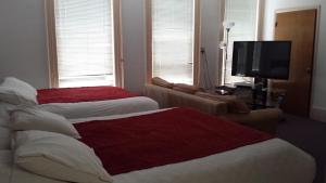 Ένα ή περισσότερα κρεβάτια σε δωμάτιο στο Sage Motel