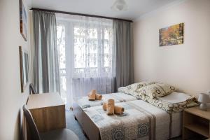 Ein Bett oder Betten in einem Zimmer der Unterkunft DW Halicz